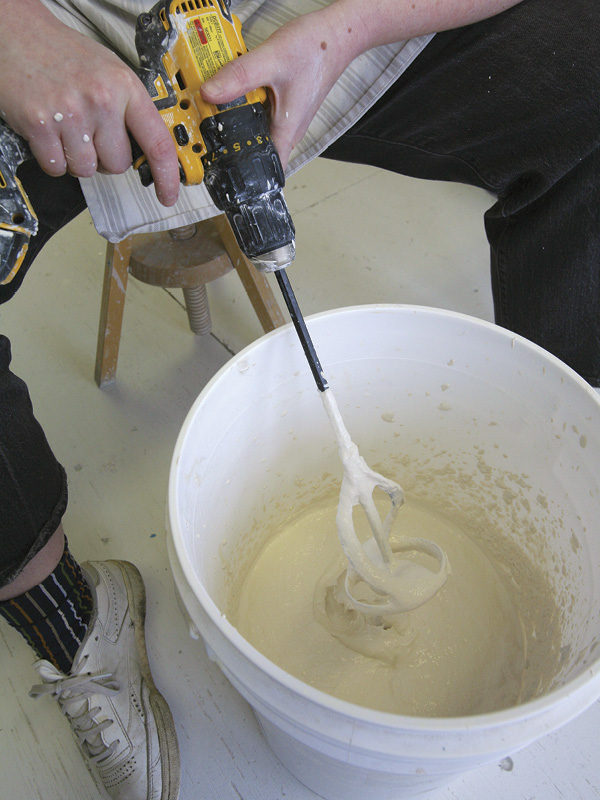 5 Mix the pulp into the slip, and blend again with the drill.