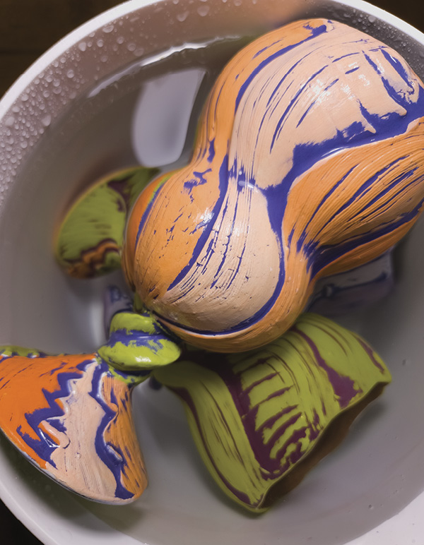 11 Soak fully colored and bisque-fired cups in water for 24 hours.