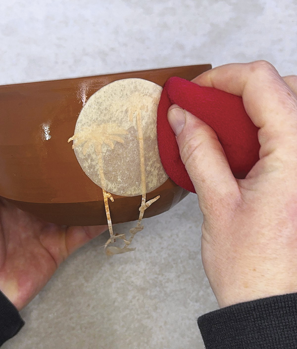 4 Cover the etched area with a newsprint shape to preserve the stencil.