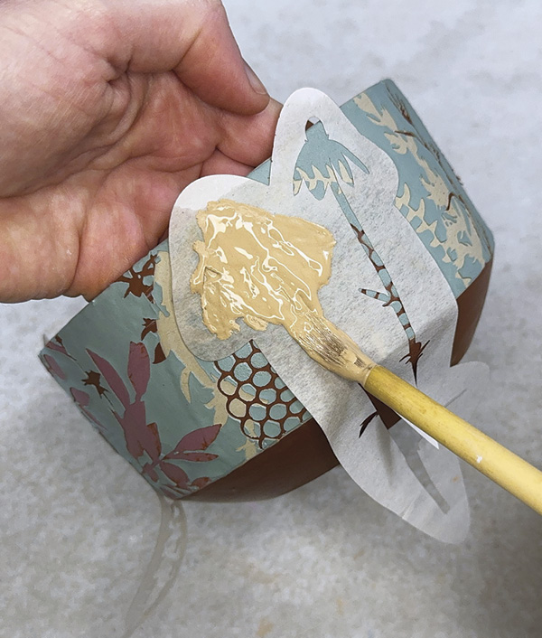 14 Apply two coats of colored slip over the negative space.