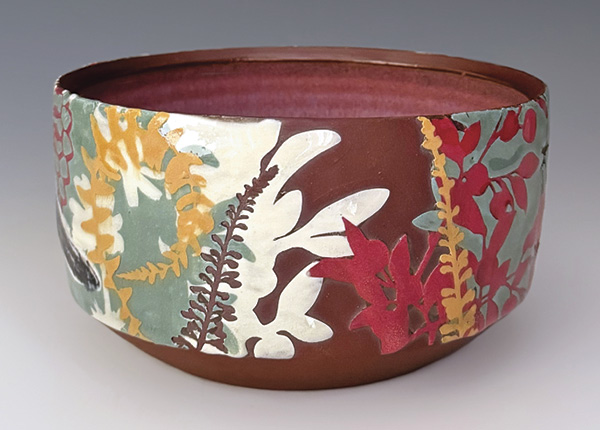 Becky Meneely's Warbler bowl (back), 5½ in. (14 cm) in diameter, wheel-thrown red stoneware, slip, underglaze, glaze, fired to cone 6 in an electric kiln.