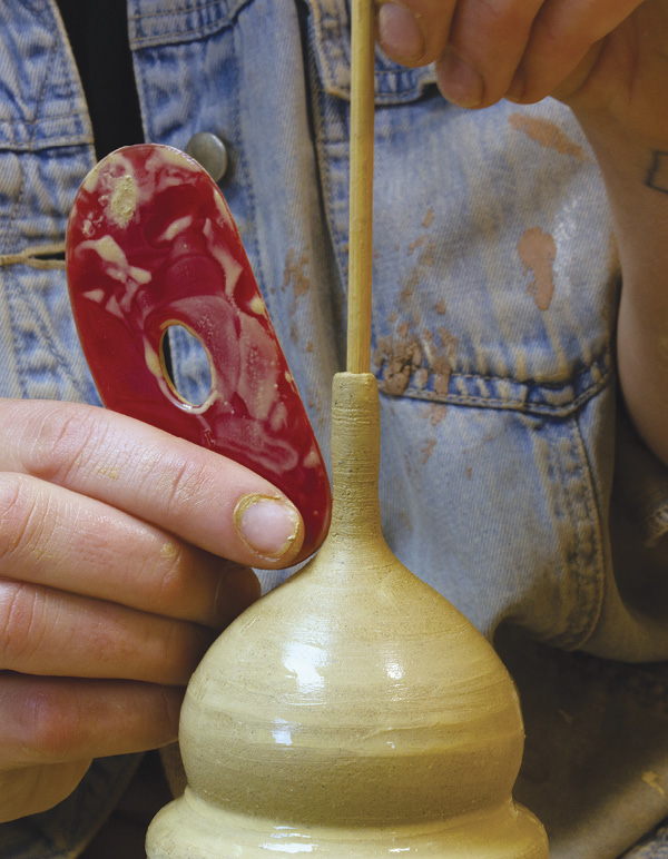 6 Use a skewer to support the interior of the spout and help gauge its radius.