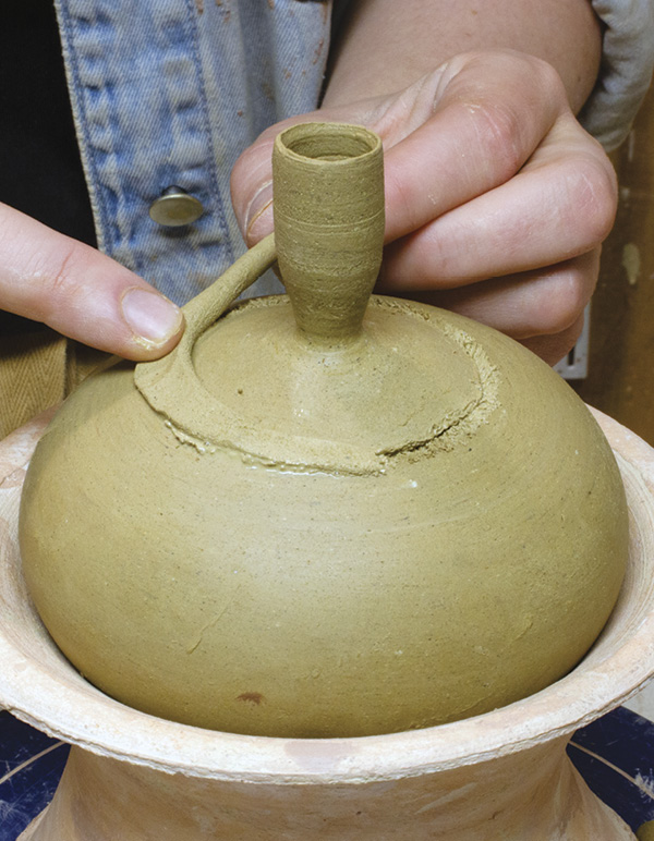 12 Score and slip attachment points, then add a soft coil along the seam.