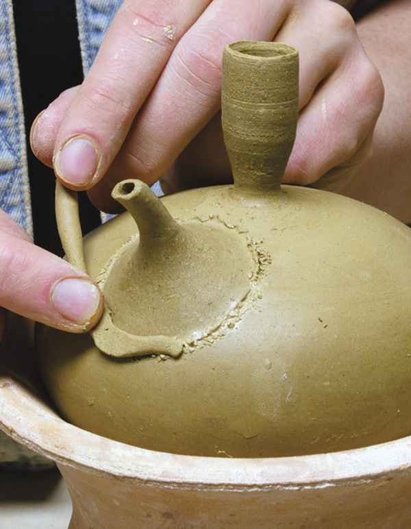 15 Score and slip the attachment, then apply a soft coil to the seam.