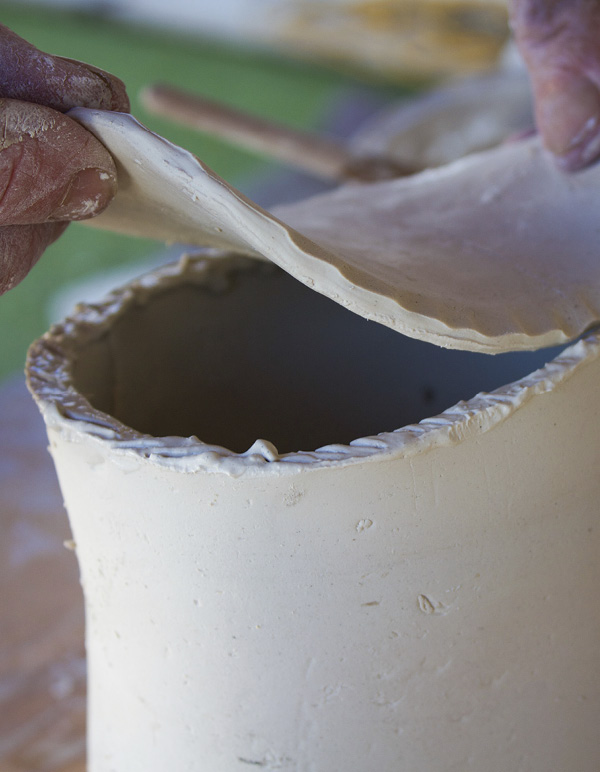 3 Attach the slab to the cylinder to create the body of the teapot.