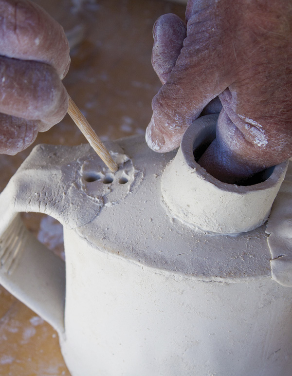 10 Poke holes for the tea infuser, which sits on the teapot behind the neck and lid.