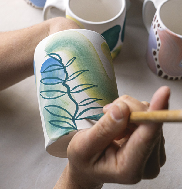 8 Add color details over the watercolor brushstrokes with a bamboo brush.