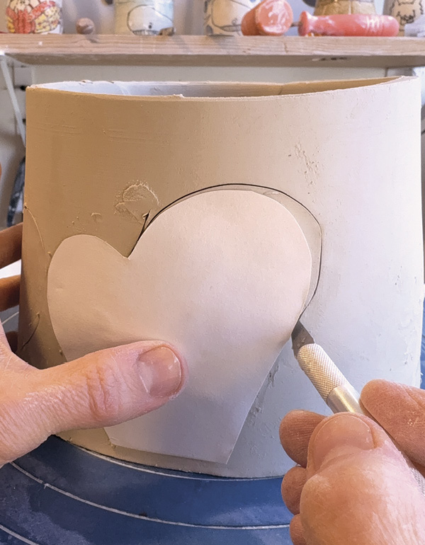 1 Use a template to cut two mirrored shapes from the slab form.