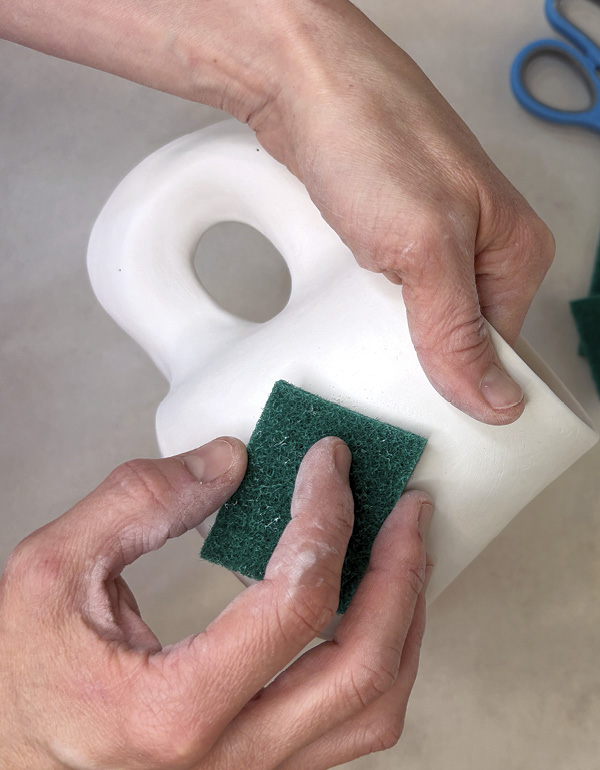 10 Once bone dry, sand any rough spots that were missed with a green scrubby.