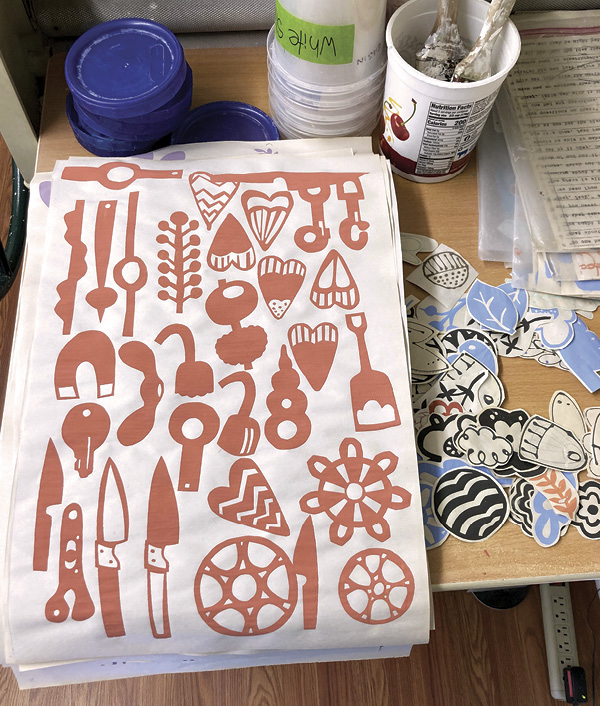 1 Screen print a variety of floofs with underglaze. Cut out individual floofs and store them for later.