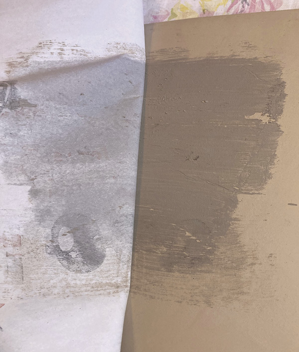 3 Flip the newsprint over, wet-slip side down, directly onto a clay slab. Burnish the back of the newsprint with a rib tool.