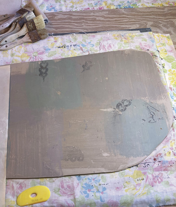 4 Peel back the newsprint. The slip has transferred to the clay surface. Repeat this process using a variety of colors.