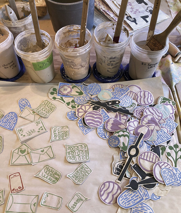 5 Gather a selection of pre-made and dried screen-printed floofs. Choose a variety of colors and shapes.