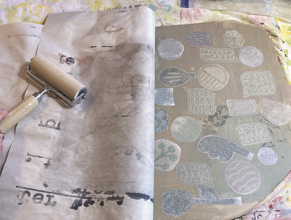 8 Continue placing floofs on the slab, burnish them with a damp sponge to transfer the colored slip to the clay.