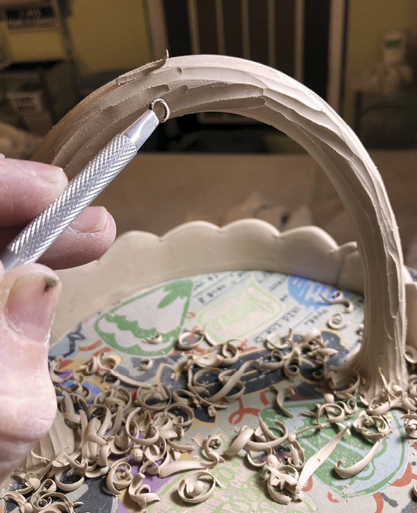 22 Use a small loop tool to add some texture to the basket handle.