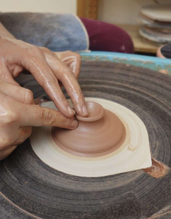 2 Throw pedestal foot. Create a shallow bowl to attach to the cup to attach.