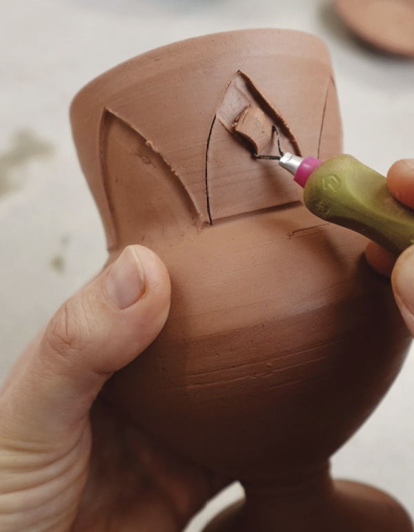 7 Draw a diamond pattern. Remove clay from within the pattern.