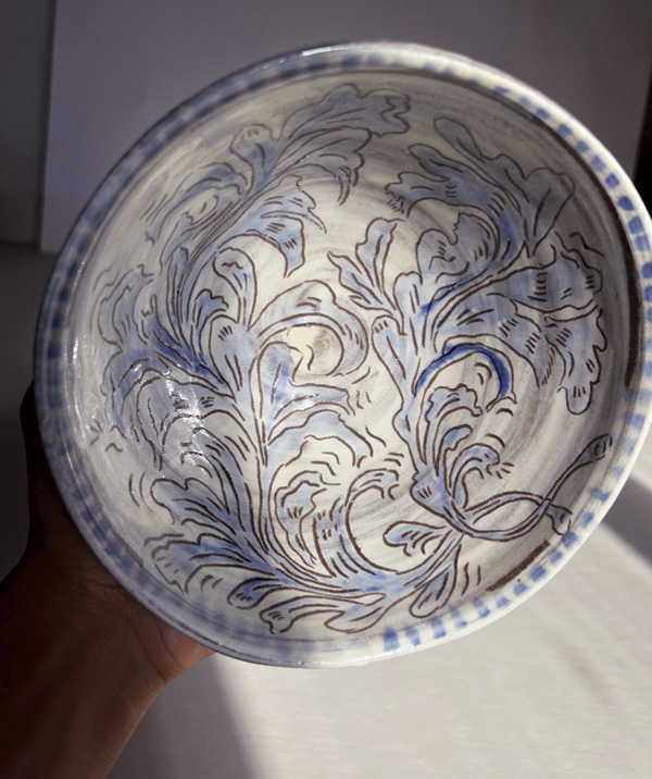 6 After bisque firing, add a thin layer of translucent clear glaze and fire it to glaze temperature.