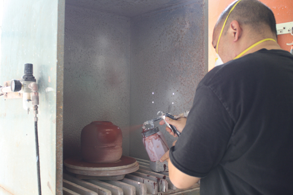 12 When glazing, spray the jar upside down first to catch the undercuts. Finish spraying once the jar is upright, with the lid in place.