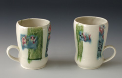 Cherry Blossom Mugs, thrown and stamped porcelain with inlaid glazes, by Meg Oliver.