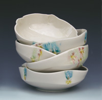 Stack of Sorbet Bowls, thrown and stamped porcelain with inlaid glazes, by Meg Oliver.