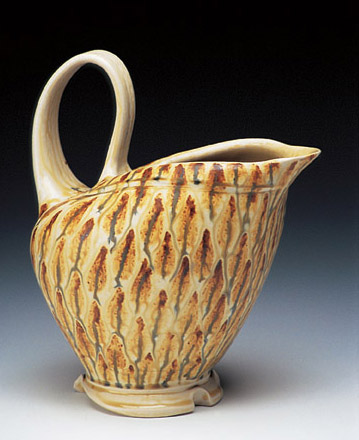 The perky tail and plump belly on this pitcher were inspired by the wrens that used to sing to Charlie Tefft in his North Carolina studio.