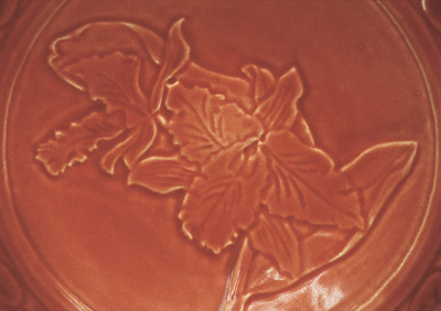 Detail of a plate glazed with Sumi's Volumetric Clear Glaze mixed with commercial stain.