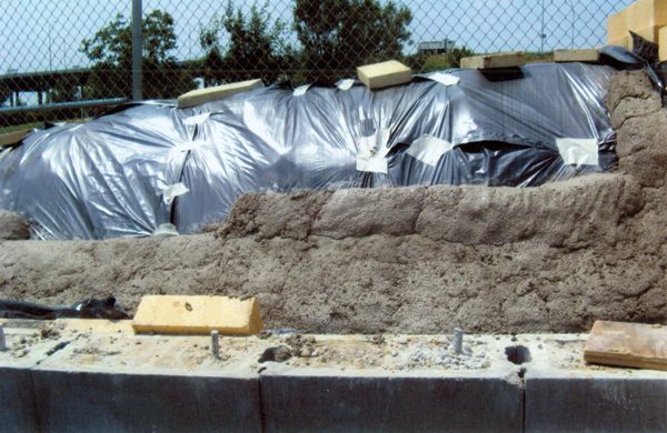 To create the domed roof, dirt is mounded and contoured then covered with plastic-a method borrowed from Fred Olsen's The Kiln Book. Castable refractory is applied over the form.