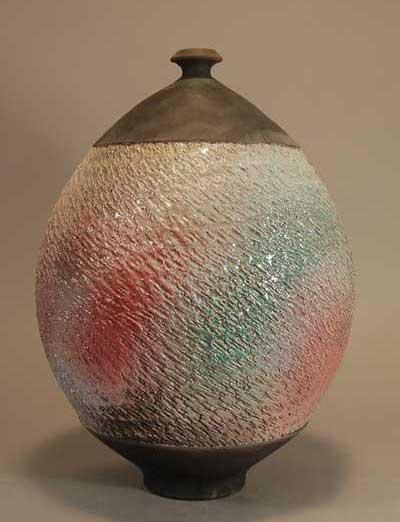 Raku Fired vase with sprayed stoneware glaze under clear raku glaze, by Steven Branfman