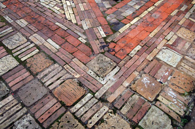 Patio paver blocks and bricks made from recycled clay and glaze waste, installed on the campus of the University of Oregon.