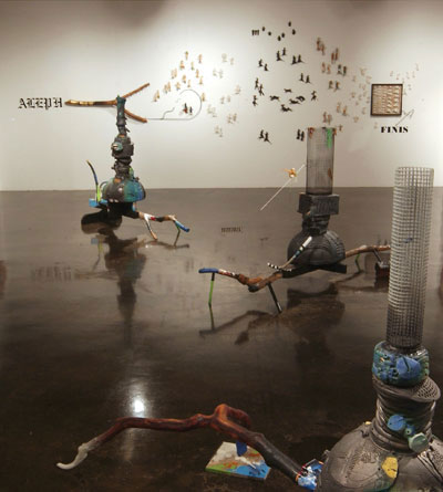 Installation view and details of Aleph. Dimensions are variable, based on wall size and continuity of wall space. Materials include several varieties of porcelain (including a black porcelain body called cassius basaltic) with glaze, stain, and acrylic paint, paper collage, fishing lures, decals, epoxy, drift wood, wooden dowels, taxidermy eyes, animal hair, and steel.