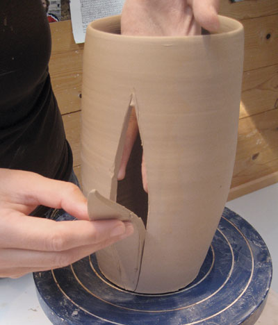 4. Cut darts out of the front and back of the cylinder to alter the shape.