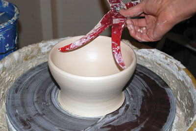 1. Measuring inside diameter of the rim of the freshly thrown bowl.