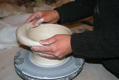 4. Forming a handle for the bowl.