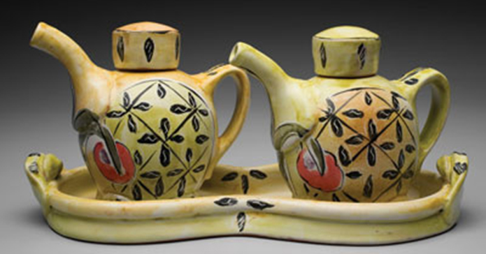 Majolica glazing techniques allow Posey Bacopoulos to create both bold lines and areas of bright color, as in the oil and vinegar ewer set shown here, without the fear of having them run or blur during the firing.