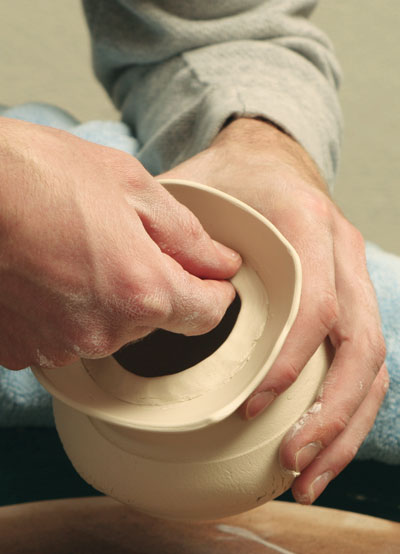 Fig.5 Score the inside of the pot, attach a coil of clay to create a flange.