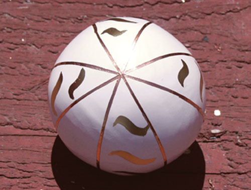 Fig.7 This sphere has designs drawn with a gold leaf pen and lines made using copper foil tape.