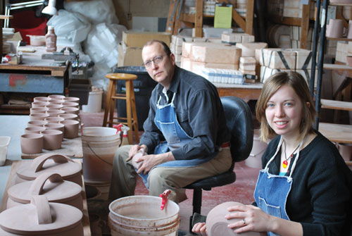 The author and her father trimming slip-cast greenware in the studio.