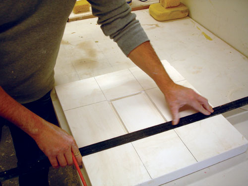 Fig.5 Use a plaster slab with a recessed rectangle, outline to create a foot for the tray. Extend the marks to locate the foot.