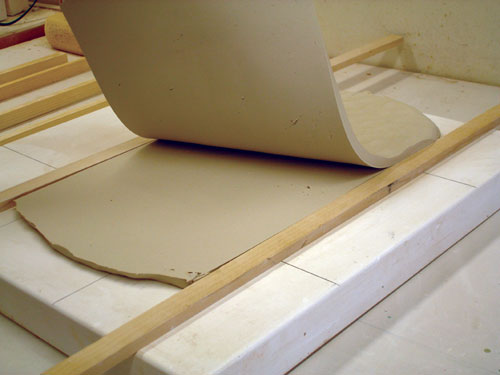 Fig.6 Use shims and a cutting wire, to trim the slab and get the exact thickness needed.