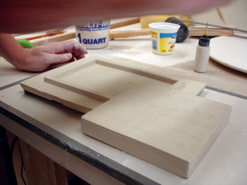 Fig.12 Score and then add soft clay where the footring of the tray meets the bottom of the saucer.