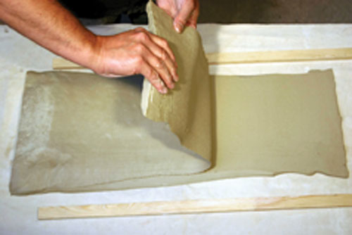 Eddie Curtis making a slabbed jar. Uniform thickness is obtained by wire-cutting the inverted slab, this preserves the dramatic textured surface. Photos: courtesy of the artist.