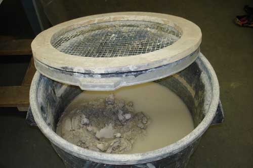 A screen over the scrap clay barrel keeps out tools and sponges, especially the dreaded needle tools.