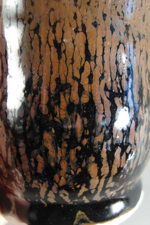 Espresso Cup (detail), porcelain with John's SG-12, then Hamada Rust over it, fired to cone 10 in oxidation, 2011. Variations in pattern can be acheived by adjusting the thickness of the undercoat (SG-12) and overcoat (Hamada Rust).