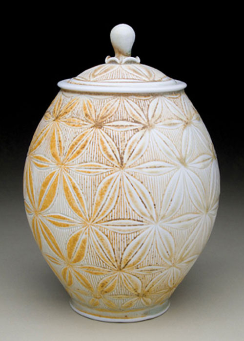 Adam Field’s covered jar, 10 in. (25 cm) in height, porcelain with carved pattern and celadon glazes, soda fired to cone 11 reduction, 2011.