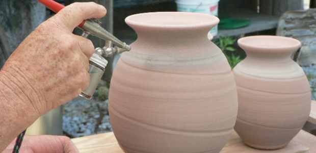 Mark Issenberg sprays fireplace wood ash glazes on pottery