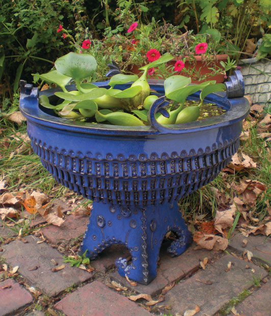 Completed garden planter, 17 inches (43 cm) in diameter, earthenware clay, sprayed cobalt glaze, fired to cone 4 in an electric kiln.