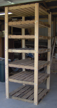 Cheap, sturdy shelves made of discarded pallets.