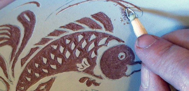Using a sgraffito tool made from a staple.