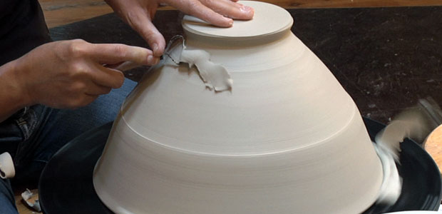 throwing a pottery bowl